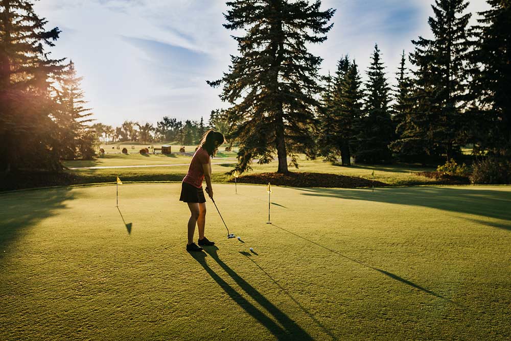 Woman playing a round of golf